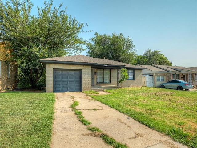 single story home featuring a garage and a front lawn