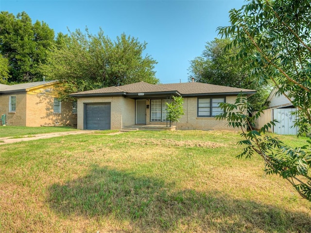 ranch-style house with a garage and a front yard