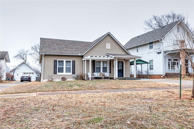 view of front of house with a porch, a garage, and a pergola