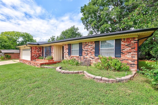 single story home featuring a garage and a front yard