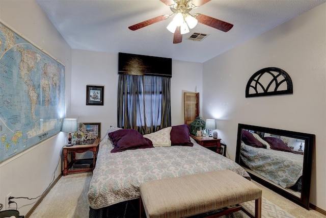 carpeted bedroom with ceiling fan