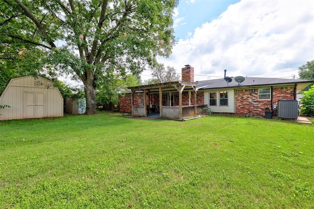 back of property featuring cooling unit, a storage unit, a yard, and a pergola