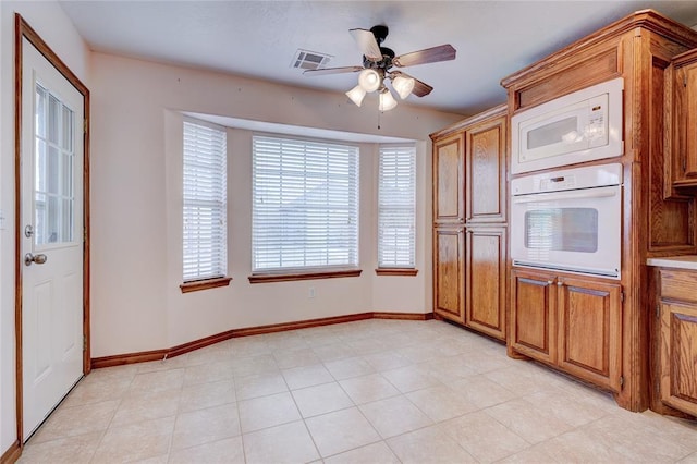 kitchen featuring white appliances and ceiling fan