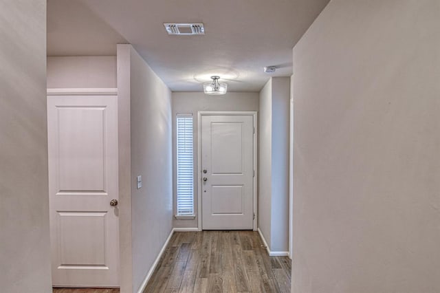 doorway with light wood-type flooring