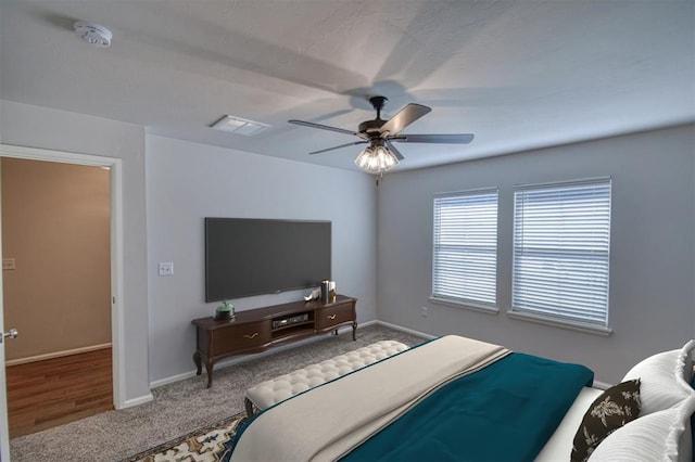 bedroom with ceiling fan and carpet