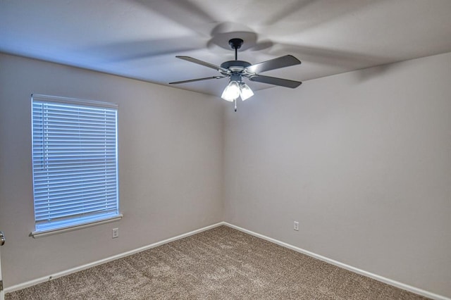 empty room featuring ceiling fan and carpet flooring