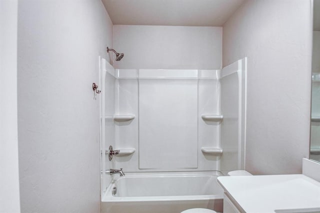 full bathroom featuring bathtub / shower combination, vanity, and toilet