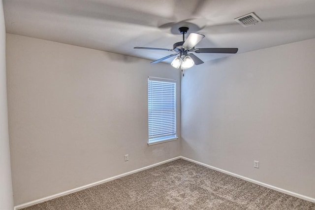 empty room featuring carpet and ceiling fan