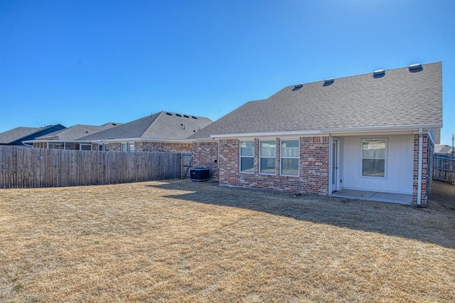 rear view of property with central air condition unit