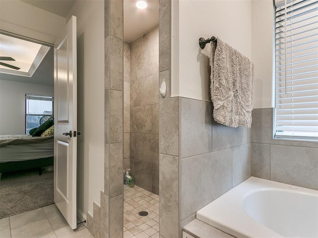 bathroom with tile patterned floors and separate shower and tub