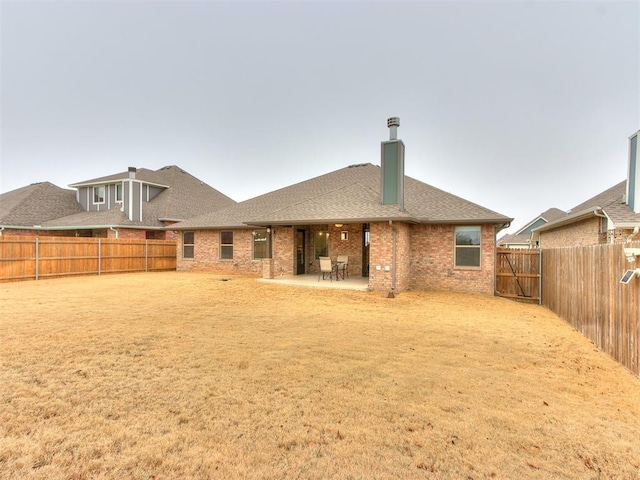 rear view of property featuring a patio