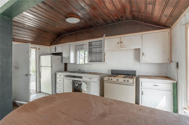 321 N Carol Ter, Mustang, OK 73064 - kitchen with vaulted ceiling, white cabinetry, sink, wooden ceiling, and white appliances