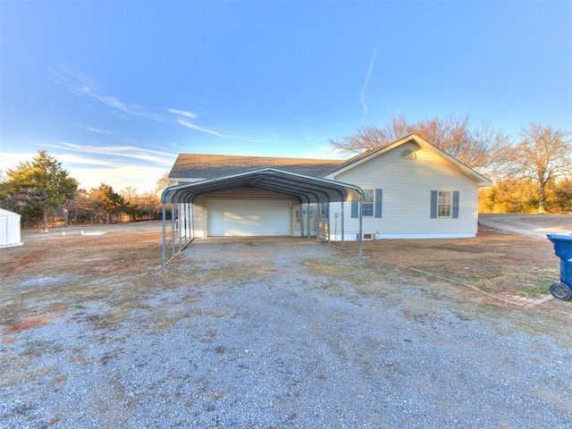 view of side of home with a carport