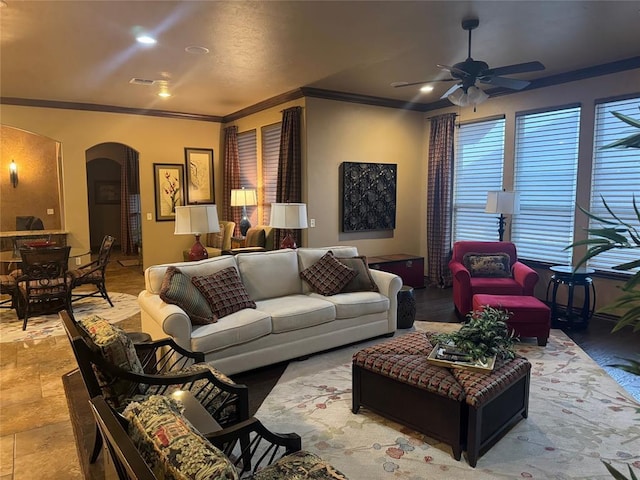 living room with crown molding and ceiling fan