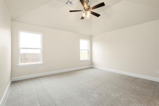 spare room with lofted ceiling, carpet floors, and ceiling fan