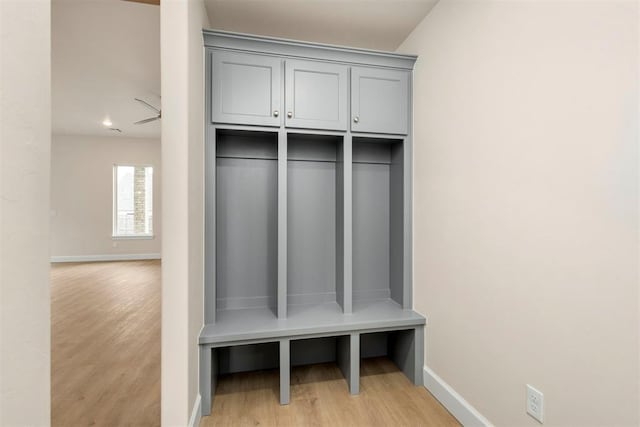 mudroom with light hardwood / wood-style floors