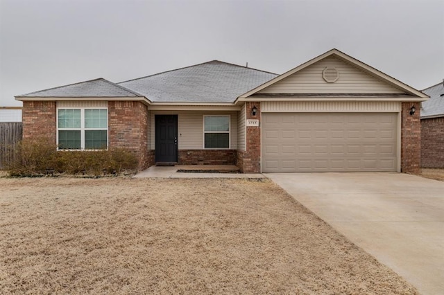 ranch-style home featuring a garage