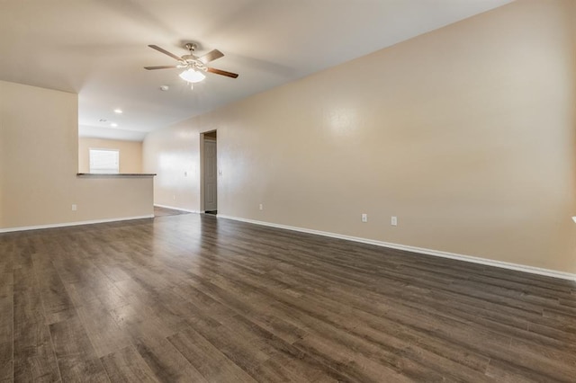 spare room with ceiling fan and dark hardwood / wood-style flooring