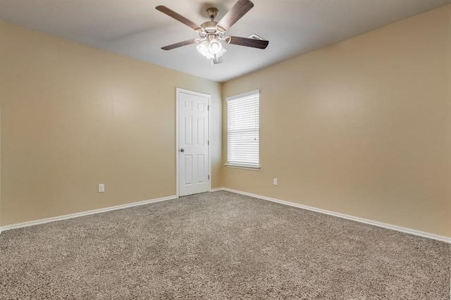 spare room featuring carpet floors and ceiling fan