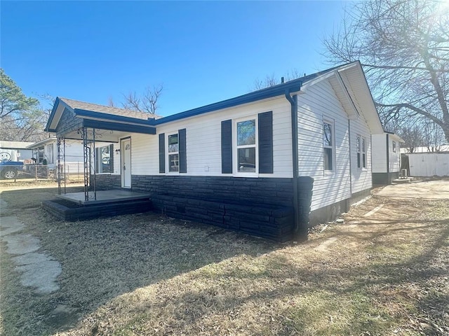 view of property exterior featuring a porch