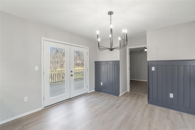 unfurnished dining area featuring french doors and light hardwood / wood-style floors