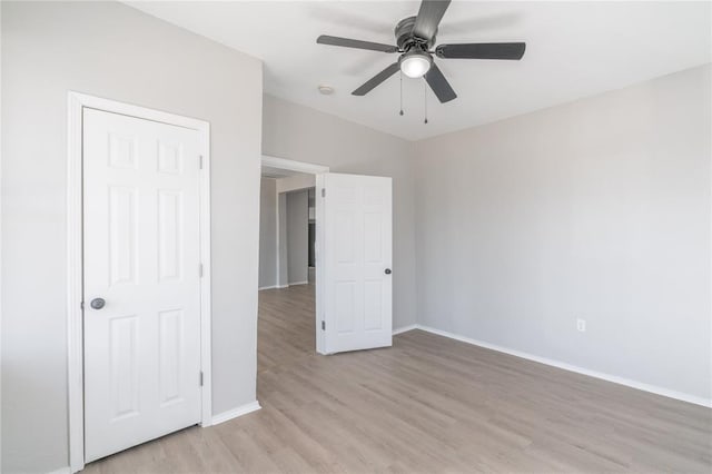 unfurnished bedroom featuring ceiling fan and light hardwood / wood-style floors