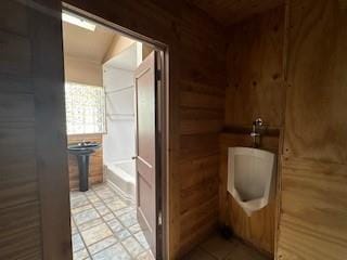 bathroom featuring a bathtub and tile patterned floors