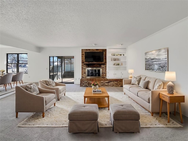 living room featuring built in features, a fireplace, carpet, and a textured ceiling