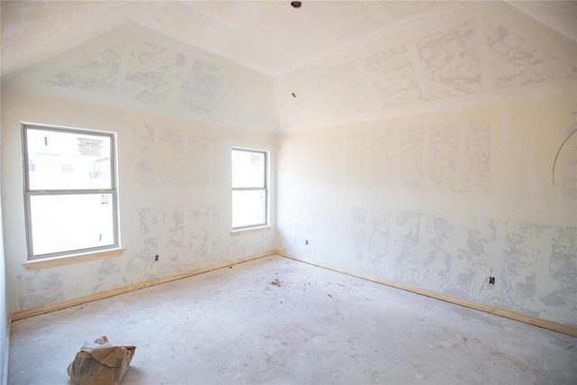 9225 NW 86th St, Yukon, OK 73099 - spare room featuring lofted ceiling and baseboards