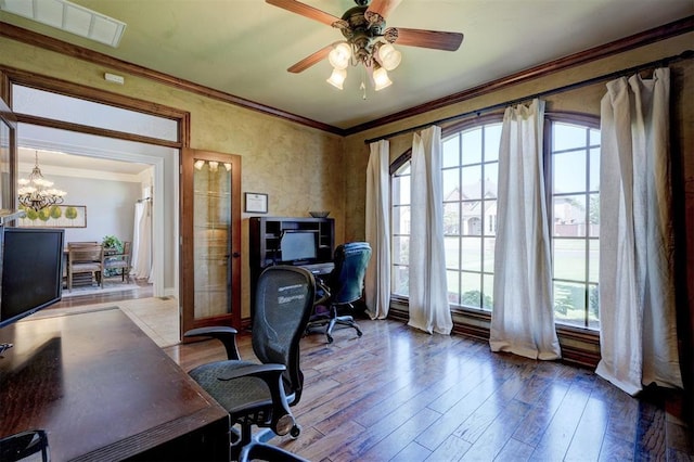 home office with crown molding, ceiling fan with notable chandelier, and hardwood / wood-style flooring