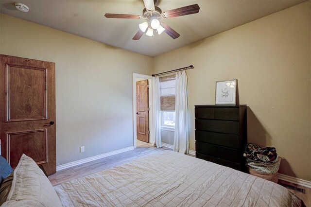 bedroom featuring ceiling fan and light hardwood / wood-style flooring