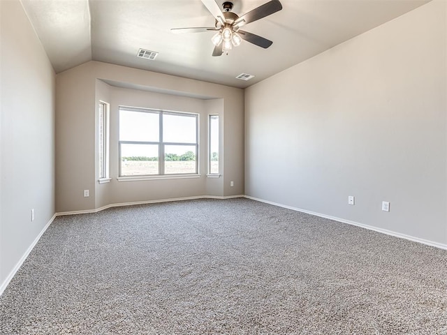 unfurnished room with ceiling fan, carpet flooring, and vaulted ceiling