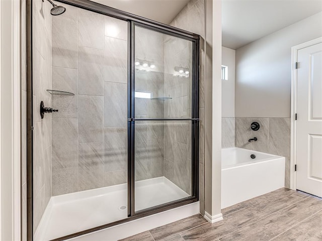 bathroom with shower with separate bathtub