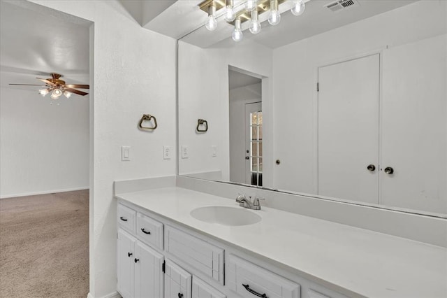 bathroom with ceiling fan and vanity