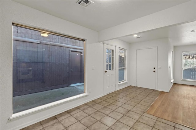 entrance foyer featuring light tile patterned floors