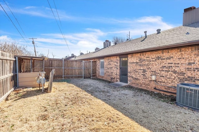 view of yard with central AC