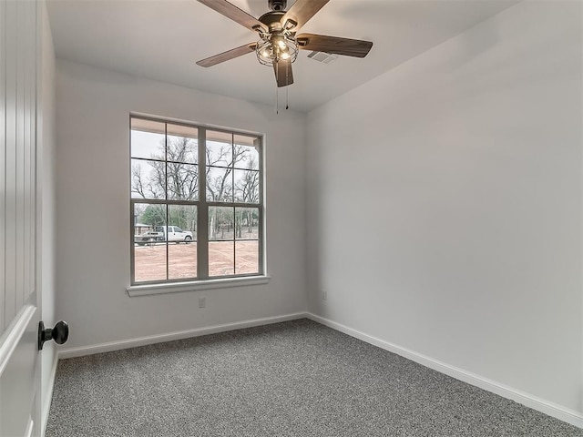 carpeted empty room with ceiling fan