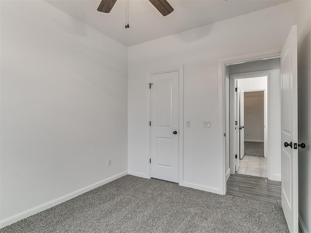 unfurnished bedroom with carpet and ceiling fan