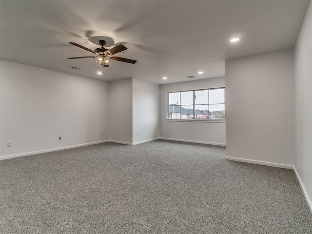 unfurnished room with carpet flooring and ceiling fan