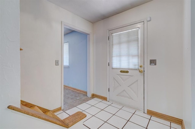 foyer with light tile patterned floors