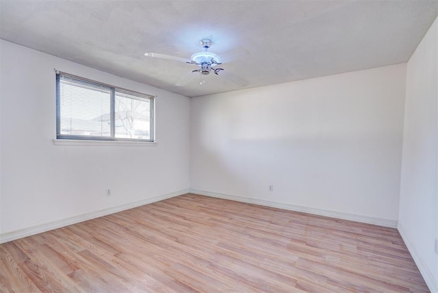 unfurnished room with light hardwood / wood-style floors and ceiling fan