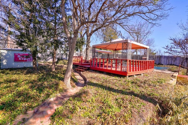 view of yard with a gazebo and a deck