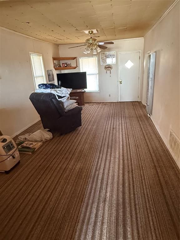 carpeted living room featuring ceiling fan