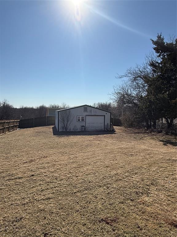 exterior space featuring an outbuilding and a garage