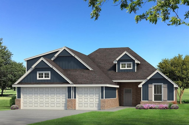 view of front of house with a garage and a front lawn