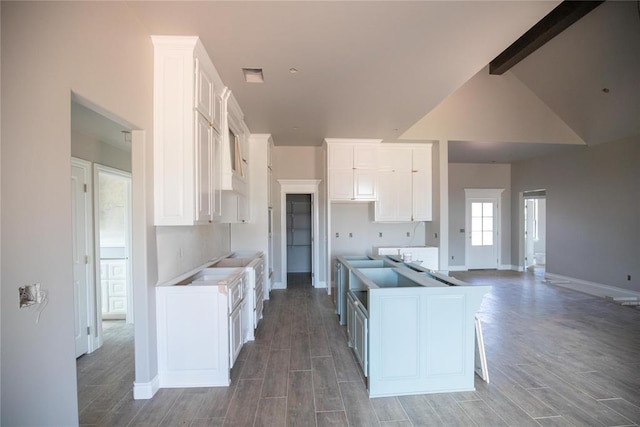 8116 NW 152nd Ter, Edmond, OK 73013 - kitchen featuring light wood-style flooring, white cabinetry, and a center island