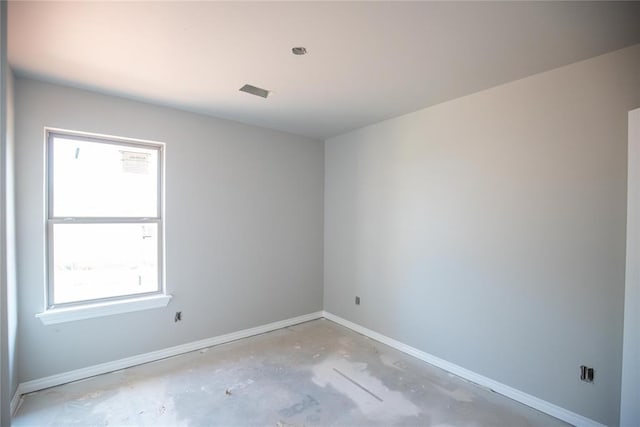 8116 NW 152nd Ter, Edmond, OK 73013 - spare room featuring baseboards and unfinished concrete flooring
