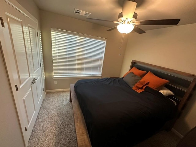 carpeted bedroom with ceiling fan