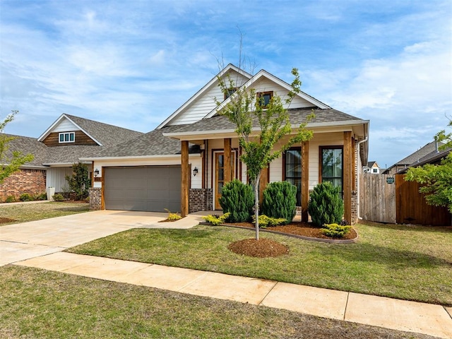 view of front of property with a garage and a front yard