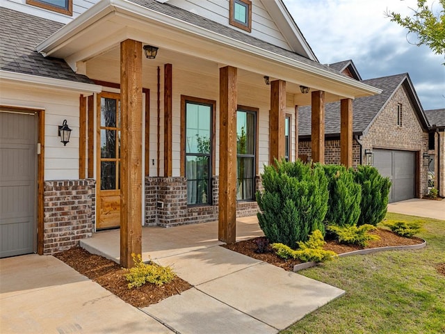 doorway to property with a porch and a garage